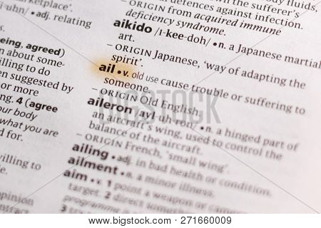 The Word Or Phrase Ail In A Dictionary Highlighted With Marker.