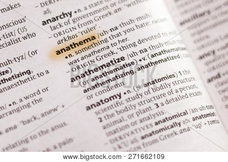 The Word Or Phrase Anathema In A Dictionary Highlighted With Marker.