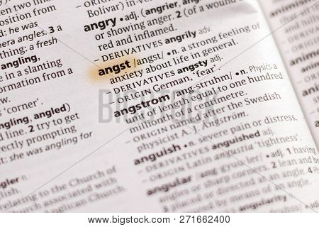 The Word Or Phrase Angst In A Dictionary Highlighted With Marker.