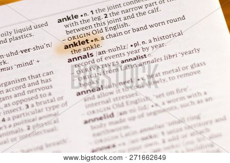 The Word Or Phrase Anklet In A Dictionary Highlighted With Marker.