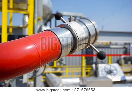 Fireplug To Put Out A Fire Against The Background Of An Installation At An Oil Refinery