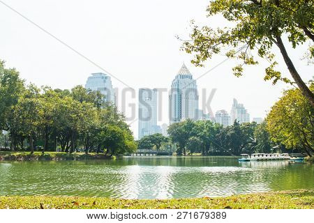 View Of Tower Building Bangkok Skyline At Lumphini Park, Pathum Wan Districts Of Bangkok.