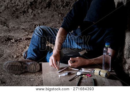Drug Abuse Concept, Overdose Male Drug Addict Hand, Drugs Narcotic Syringe In Hand On The Floor