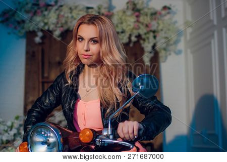 Sexy Biker Lady In Black Leather Jacket Sit On Vintage Custom Caferacer Motorbike And Touch Her Hair