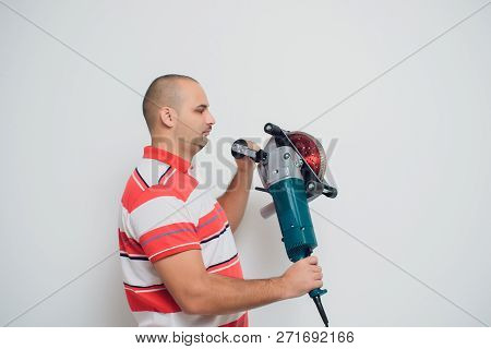 Construction Worker With A Puncher Scream On A White Background.