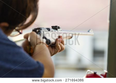 Bangkok Thailand, Nov 24, 2018:- Woman Hold A Gun Ready To Shoot  Practicing Shooting At Shooting Ra