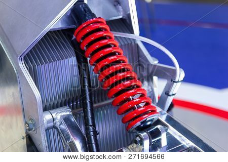 Red Motorcycle Shock Absorbers A Device For Absorbing Jolts And Vibrations.