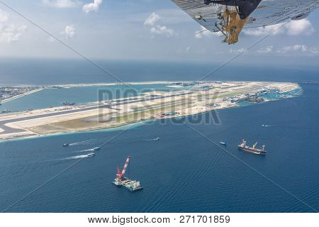 Seaplane Fly Over Airport In Maldives, New Airport Build And Construction.