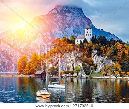 Beautiful Scenic Sunset Over Austrian Alps Lake. Boats, Yachts In The Sunlight Infront Of Church On 