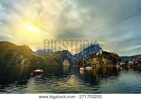 Beautiful Scenic Sunset Over Austrian Alps Lake. Boats, Yachts In The Sunlight Infront Of Church On 