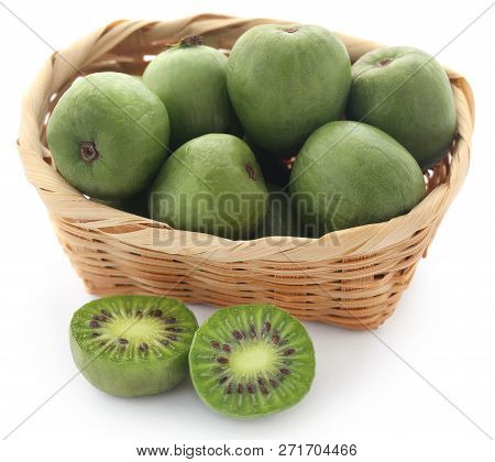 Actinidia Arguta Known As Baby Kiwi Over White Background