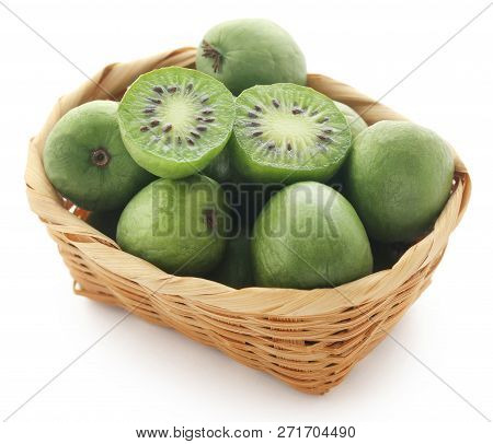 Actinidia Arguta Known As Baby Kiwi Over White Background
