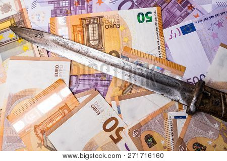 A Crime Knife On Euro Cash, Extortion Or Robbery Concept