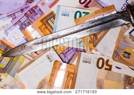 A Crime Knife On Euro Cash, Extortion Or Robbery Concept