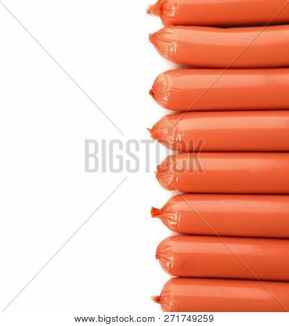 Encased Sausages On White Background, Top View With Space For Text. Meat Product
