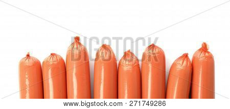 Encased Sausages On White Background, Top View With Space For Text. Meat Product