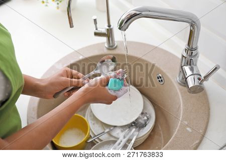 Woman Doing Washing Up In Kitchen Sink, Closeup View. Cleaning Chores