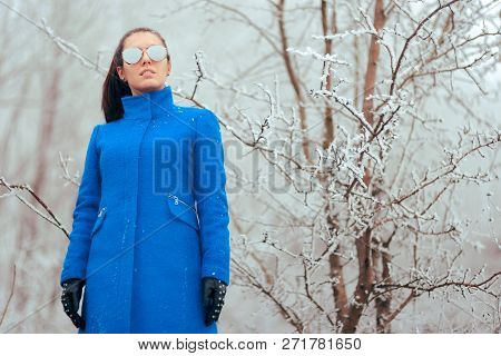 Fashion Winter Woman With Mirror Sunglasses And Blue Coat
