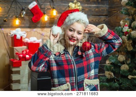 Christmas Decorations And Gift Box On Wooden Background. Funny Laughing Surprised Woman Portrait. Em
