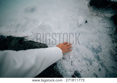 Scientist Or Tourist Touches Sulfur Waer In Geizer