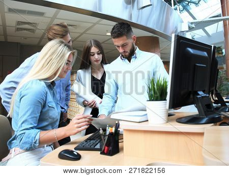 Group Of Young Modern People In Smart Casual Wear Having A Brainstorm Meeting While Standing In The 