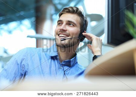 Smiling Friendly Handsome Young Male Call Centre Operator.