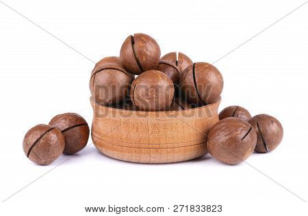 Macadamia Nuts In Wooden Plate, Isolated On White Background. Unshelled Macadamia.
