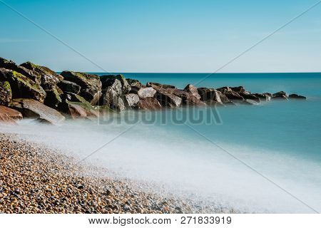 Saltdean Beach Seafront Undercliff With Beautiful Blue Water And Rock Breakwater Beach In Background