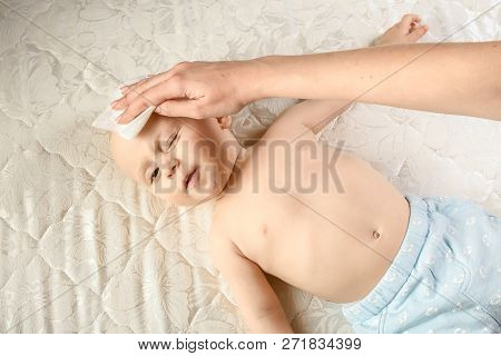 Momy Wiping The Baby Skin With Wet Wipes. Funny Baby Emotions. Baby Care Hygiene. Cleaning Wipe, Pur