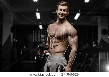 Sexy Strong Bodybuilder Athletic Men Pumping Up Muscles With Dumbbells