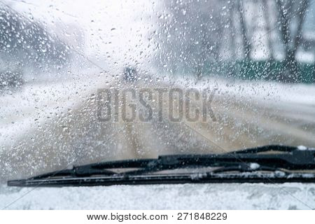 Poor Visibility On The Road. Car Rides On Slippery Road. Snow And Rain On The Windshield. Blurred Ba
