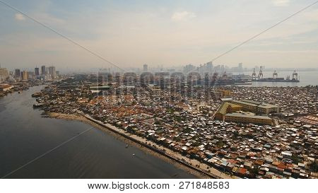 Aerial View Poor District Of Manila Slums, Ghettos, Wooden Old Houses, Shacks. Slum Area Of Manila, 