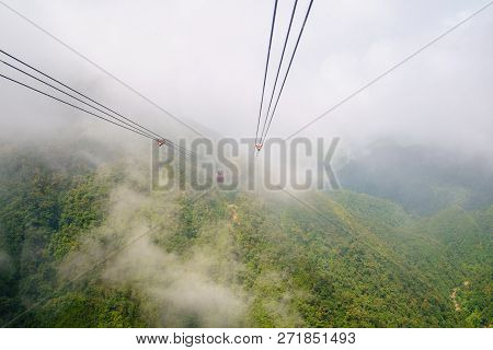 Inside View Cable Car In The Middle Of The Valley, Fog In Cloud Background Of Country Going To Fansi