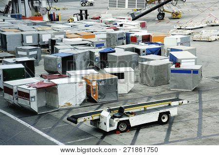 Containers With Airfreight For An Aeroplane At An Airport