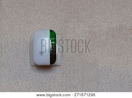 Repeater Wi-fi Signal In An Electrical Socket On The Wall.