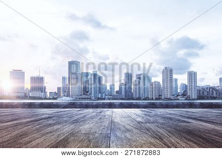 Beauitful Roof Top City View With Sunlight And Clouds In Sky. Urban Background Concept
