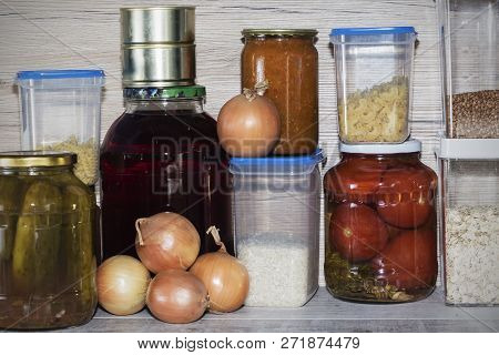 Storage Shelves In Pantry With Homemade Canned Preserved Fruits And Vegetables