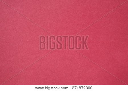 Pink Colored Construction Paper. Close up view of Colored Construction Paper. Backgrounds and Textures. Opacity filter used to lighten and grade the image.


