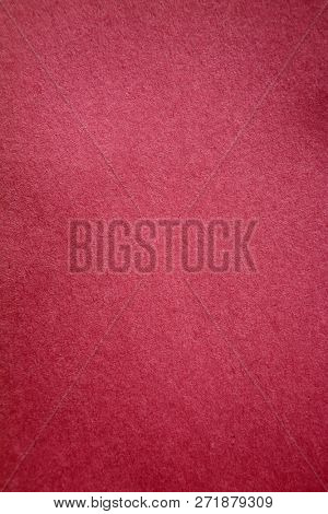 Pink Colored Construction Paper. Close up view of Colored Construction Paper. Backgrounds and Textures. Opacity filter used to lighten and grade the image.


