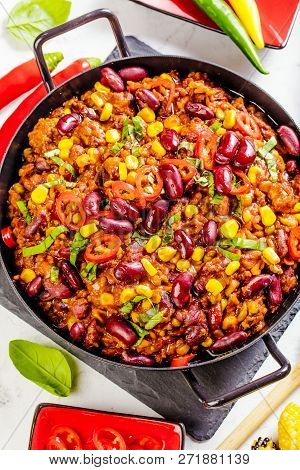 Chili Con Carne In A Clay Bowl On A Concrete Or Stone Rustic Background- Traditional Dish Of Mexican