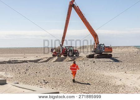 Excavator On The Beach In Norre Vorupor, Denmark, Europe.