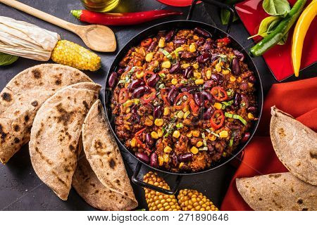 Chili Con Carne In A Clay Bowl On A Concrete Or Stone Rustic Background- Traditional Dish Of Mexican