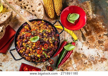 Chili Con Carne In A Clay Bowl On A Concrete Or Stone Rustic Background- Traditional Dish Of Mexican