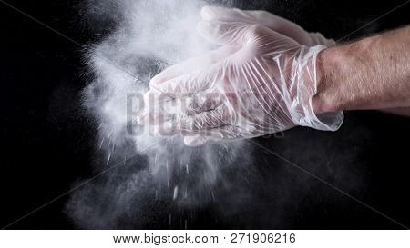 Chef Hands Clapping With Flour In Slow Motion On Black Background. Frame. Chef Claps Hands Together 