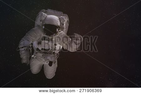 Single Astronaut In Outer Space. Science Fiction Wallpeper. Elements Of This Image Were Furnished By