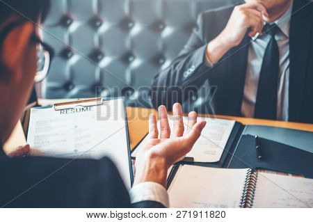 Employee Young Man Explaining About His Profile Resume To Senior Manager During Job Interview Concep