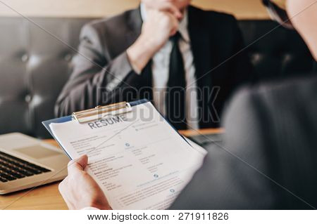 Employee Young Man Explaining About His Profile Resume To Senior Manager During Job Interview Concep