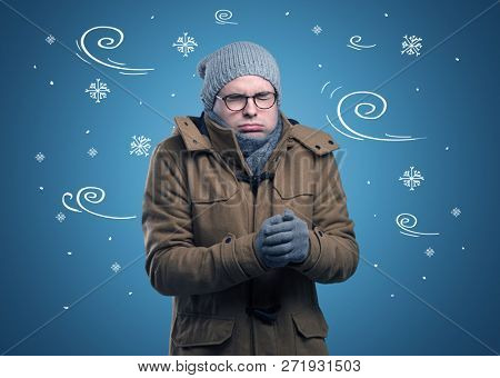 Young hipster frozen boy with doodled snowflakes and windy concept