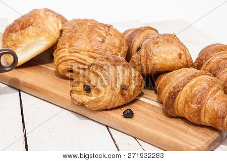 An Buttercake With Raisins And Croissant Is Made Of Puff Pastry