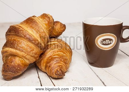 An Buttercake With Raisins And Croissant Is Made Of Puff Pastry